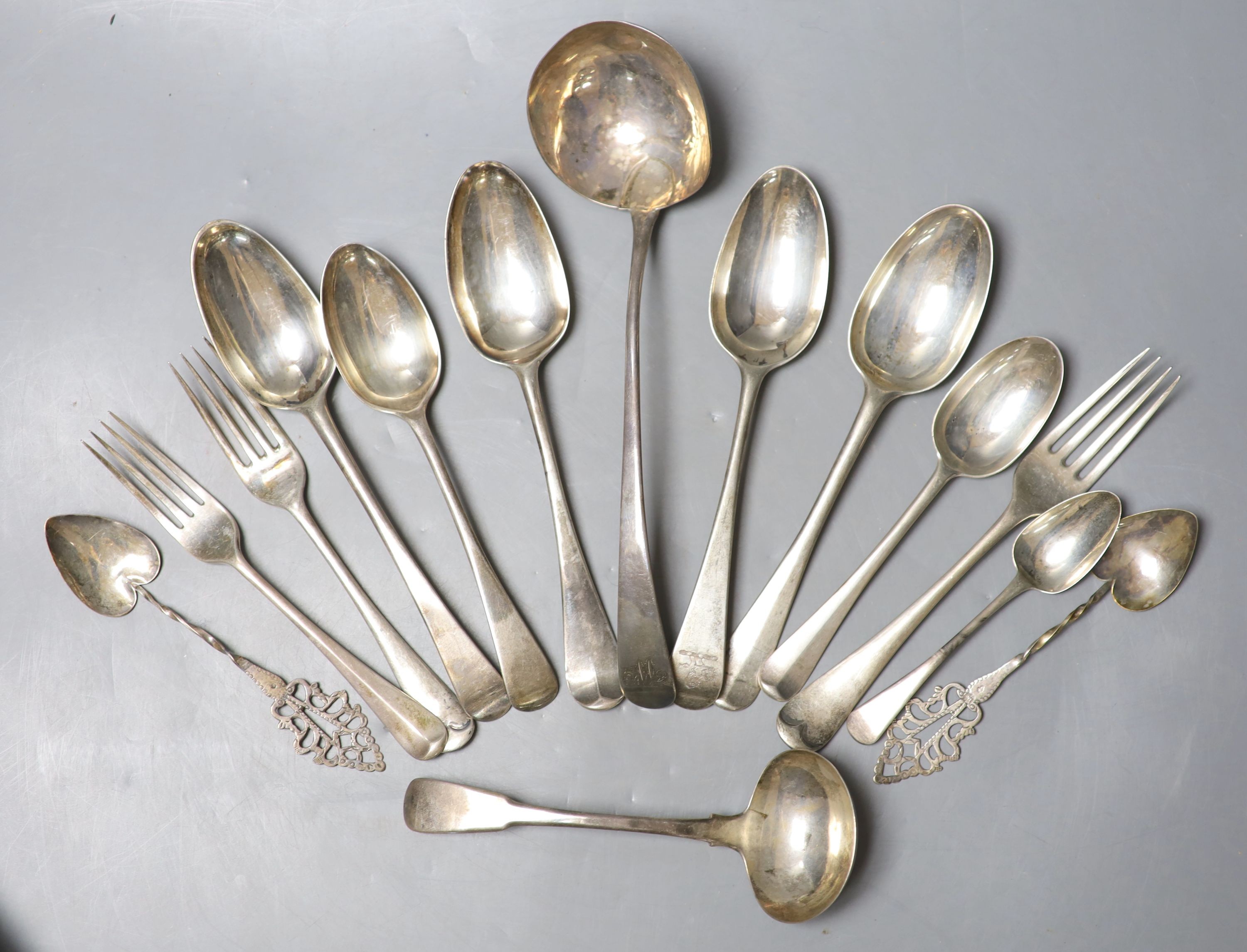 Twelve items of 18th century and later silver flatware, various dates, makers and patterns and two continental white metal spoons with pierced terminals